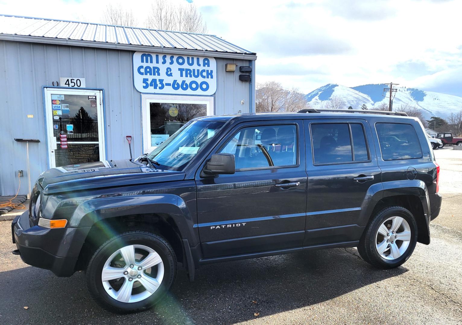 2014 Blue /Black Jeep Patriot Latittude (1C4NJRFB7ED) with an 2.4L I4 engine, 6 Speed Automatic transmission, located at 450 N Russell, Missoula, MT, 59801, (406) 543-6600, 46.874496, -114.017433 - Nice 4WD SUV. Heated Seats.6 Speed Automatic Transmission. 2.4L I4 Engine. Air. Cruise. Tilt. AM FM CD Satellite Radio. Firestone All-Season Tires. Power Windows and Locks. - Photo#0